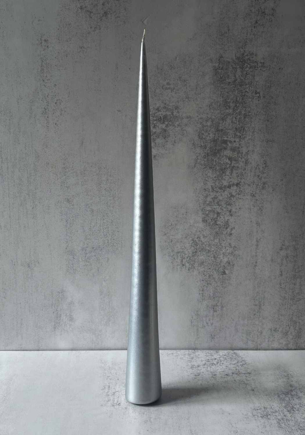 Extra tall metallic silver tapered cone candle for luxury table settings.