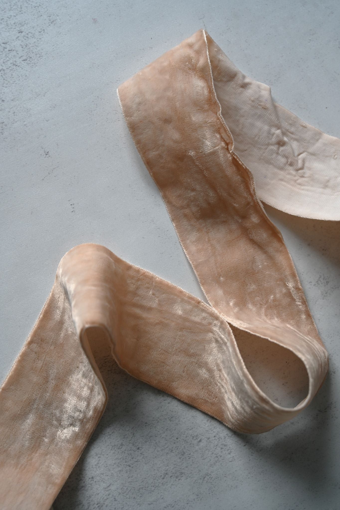 Wide 5cm Ballerina Pink cotton velvet ribbon draped on a light grey surface.