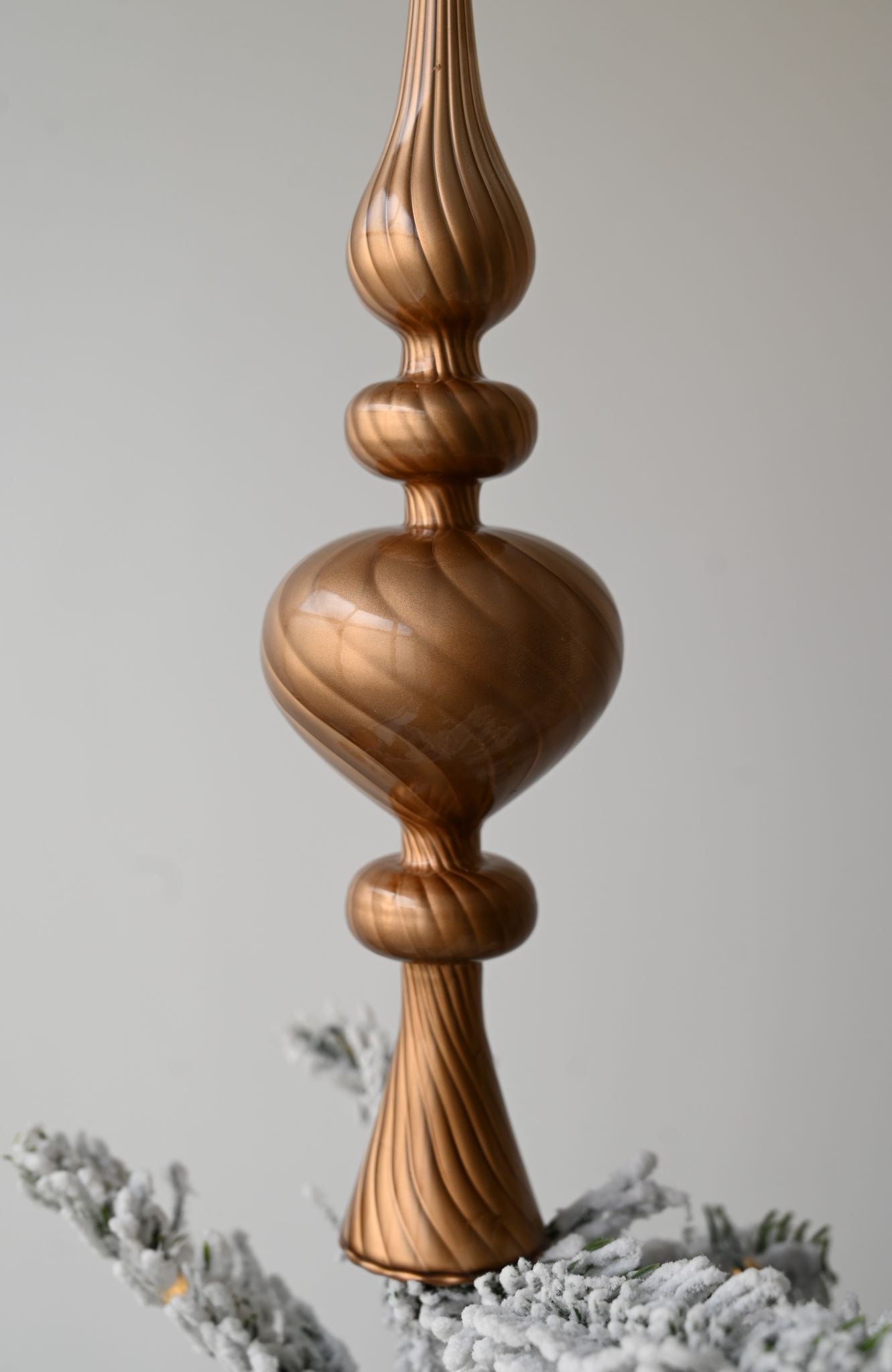 Ornate pearly copper twisted glass finial Christmas tree topper decoration.