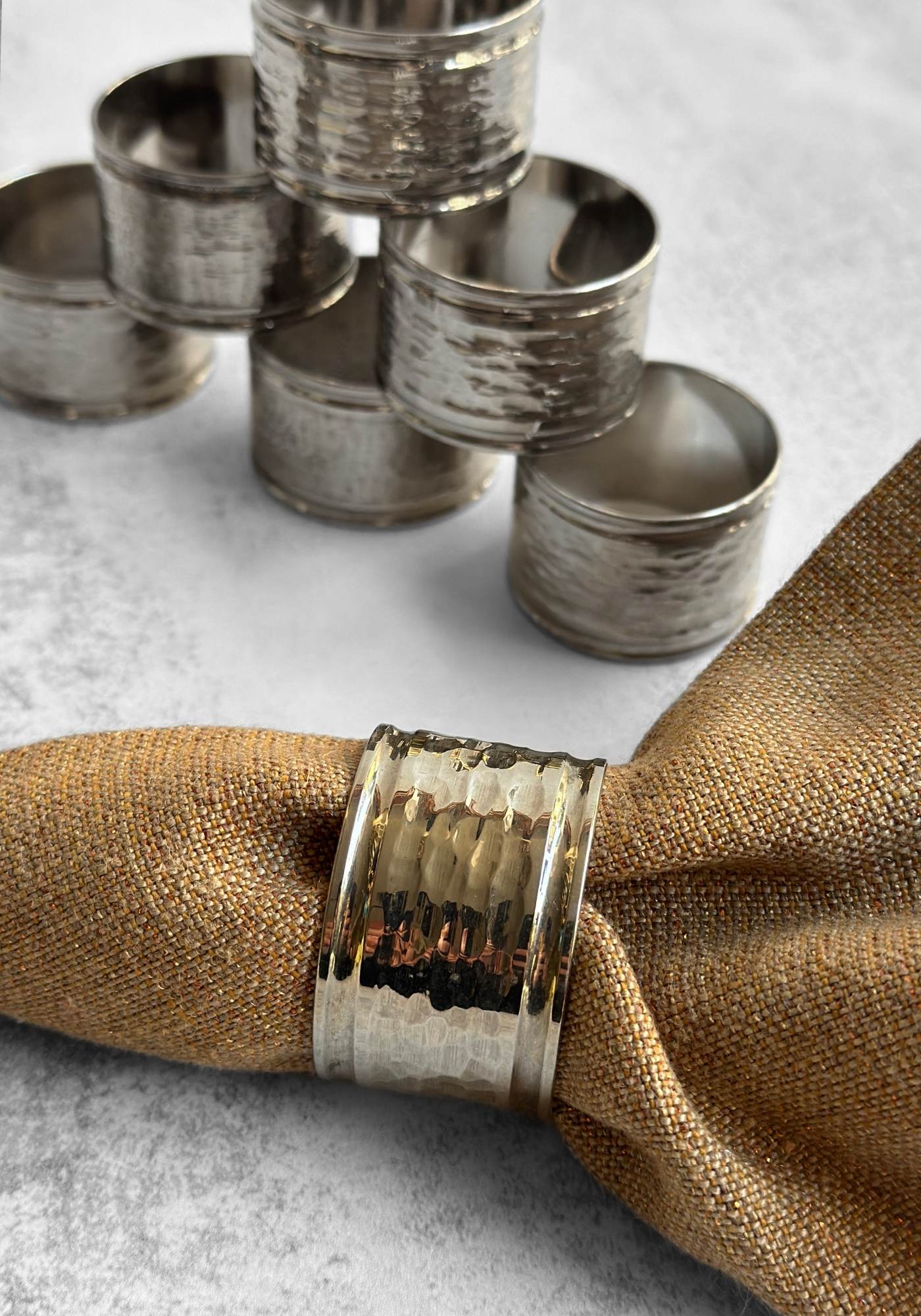Set of Nine Hammered Silver Napkin Rings