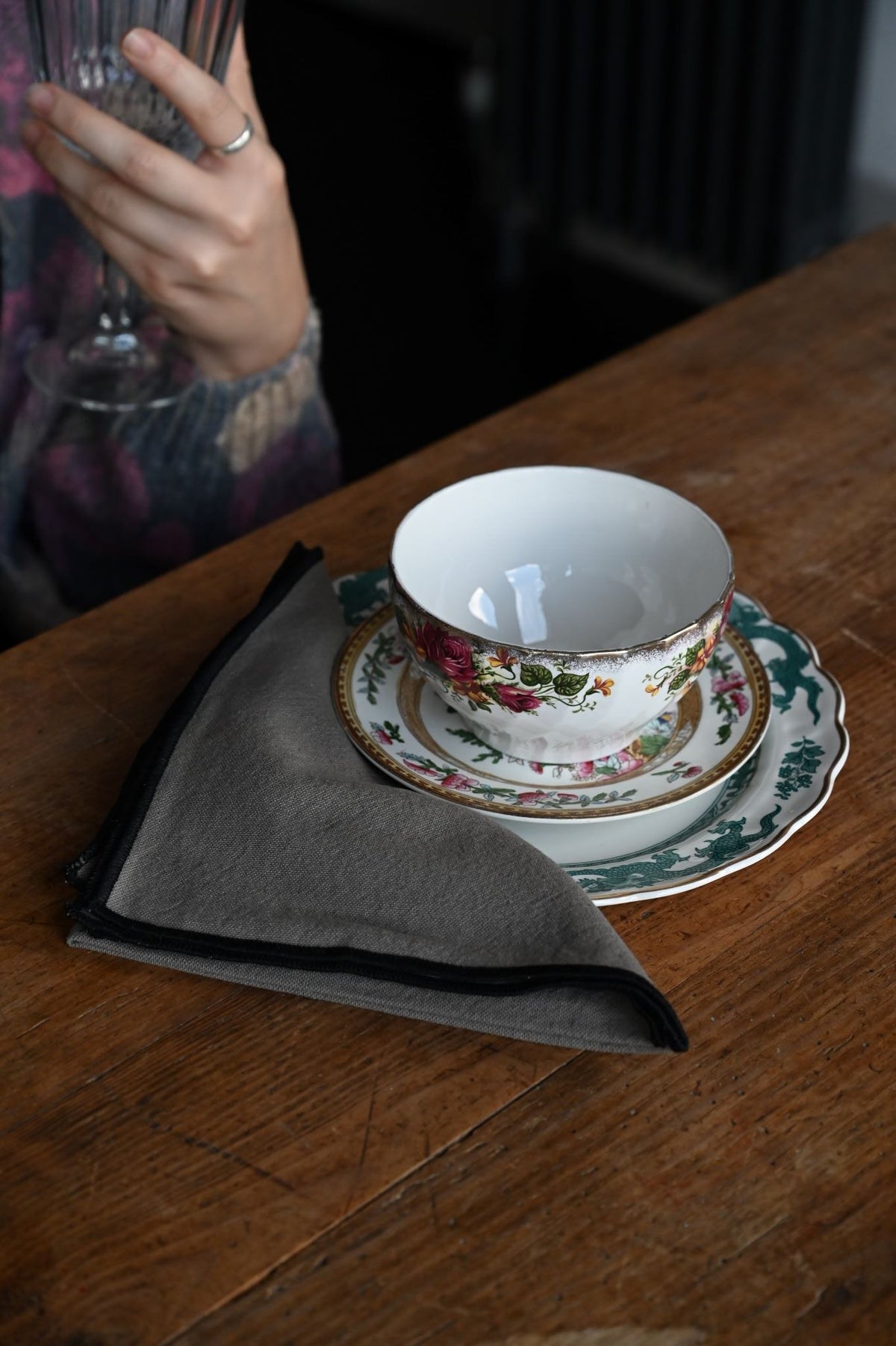 Stacked recycled cotton napkins in assorted colours with black bourdon border stitching.