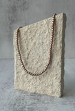 Collier de perles taupe