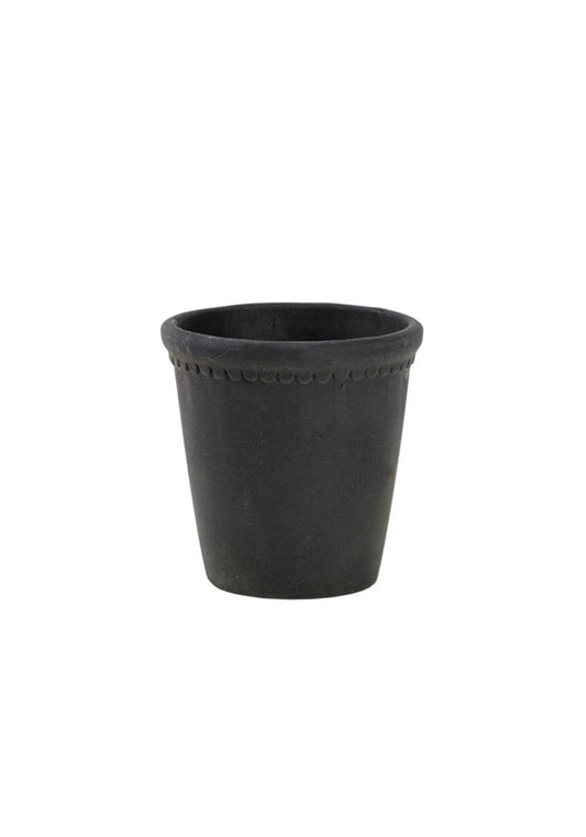 Stacked charcoal grey clay plant pots with decorative scalloped rims and a weathered finish.