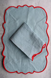 Sky Blue Scalloped Placemat with Red Border
