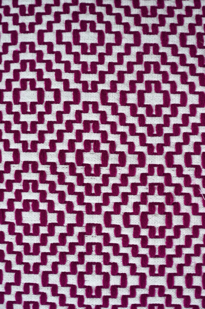 Patterned fabric with a geometric design in purple and white