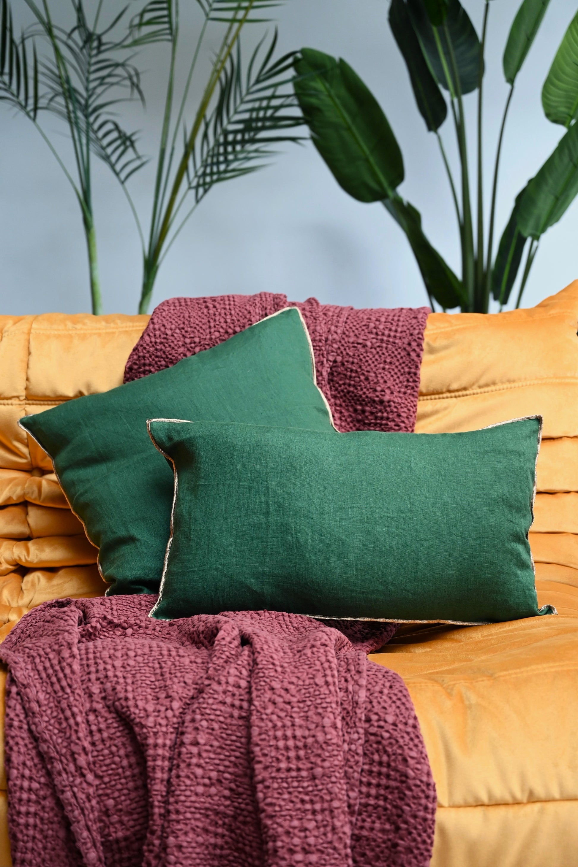 Green linen cushions with fringe edge