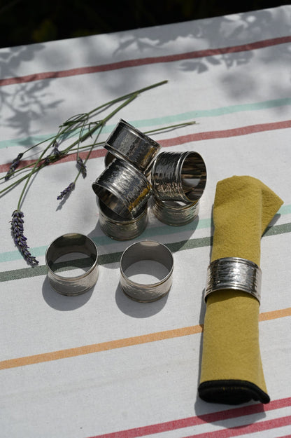 Set of Nine Hammered Silver Napkin Rings