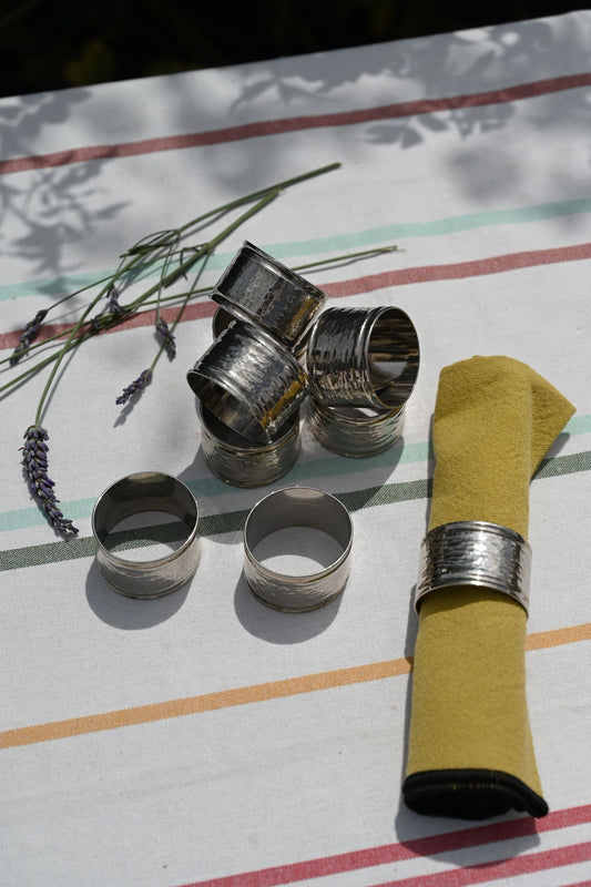 Set of Nine Hammered Silver Napkin Rings