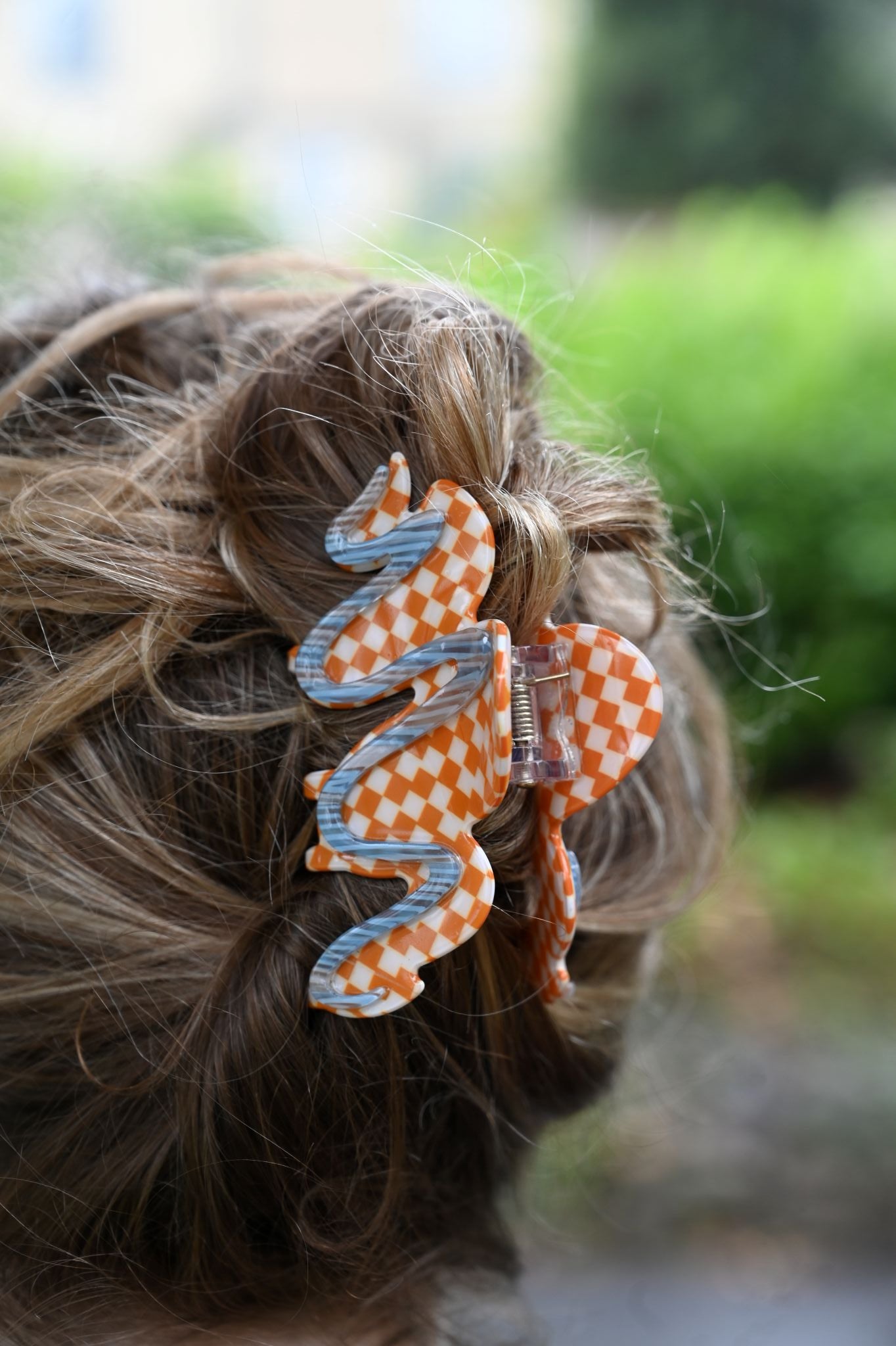 Hair clip with checkered pattern on a blurred background