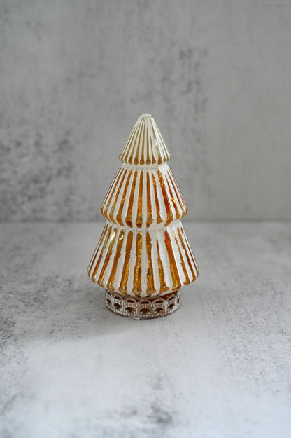 Decorative glass tree with striped pattern on a gray surface