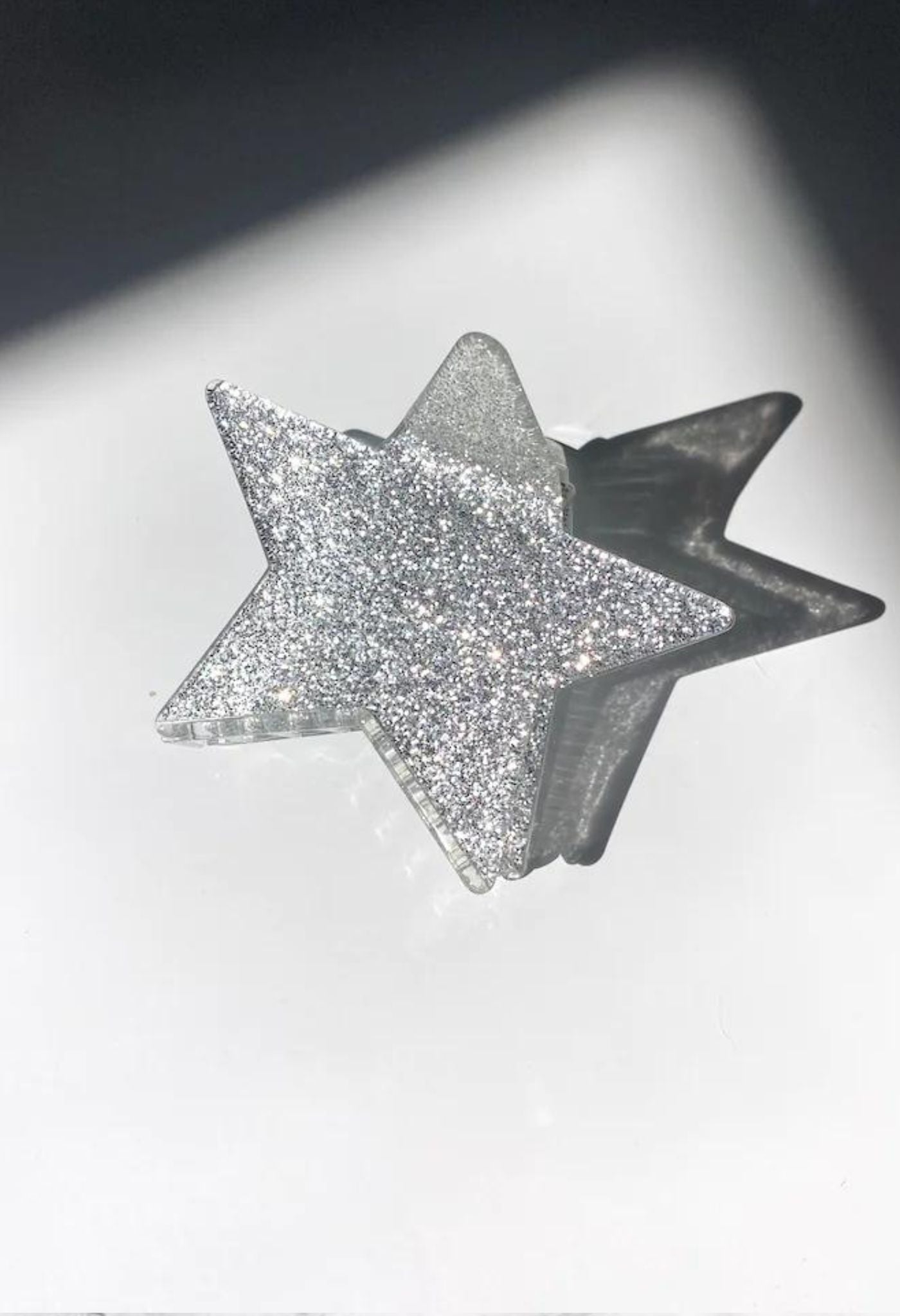 Silberne glitzernde Haarklammer mit großem Stern 