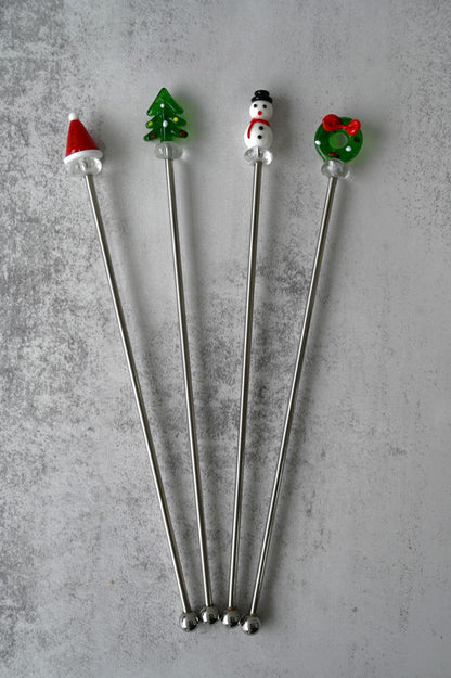 Set mit vier weihnachtlichen Cocktailrührern 