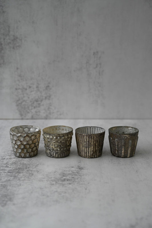 Lot de quatre bougies votives en verre antique