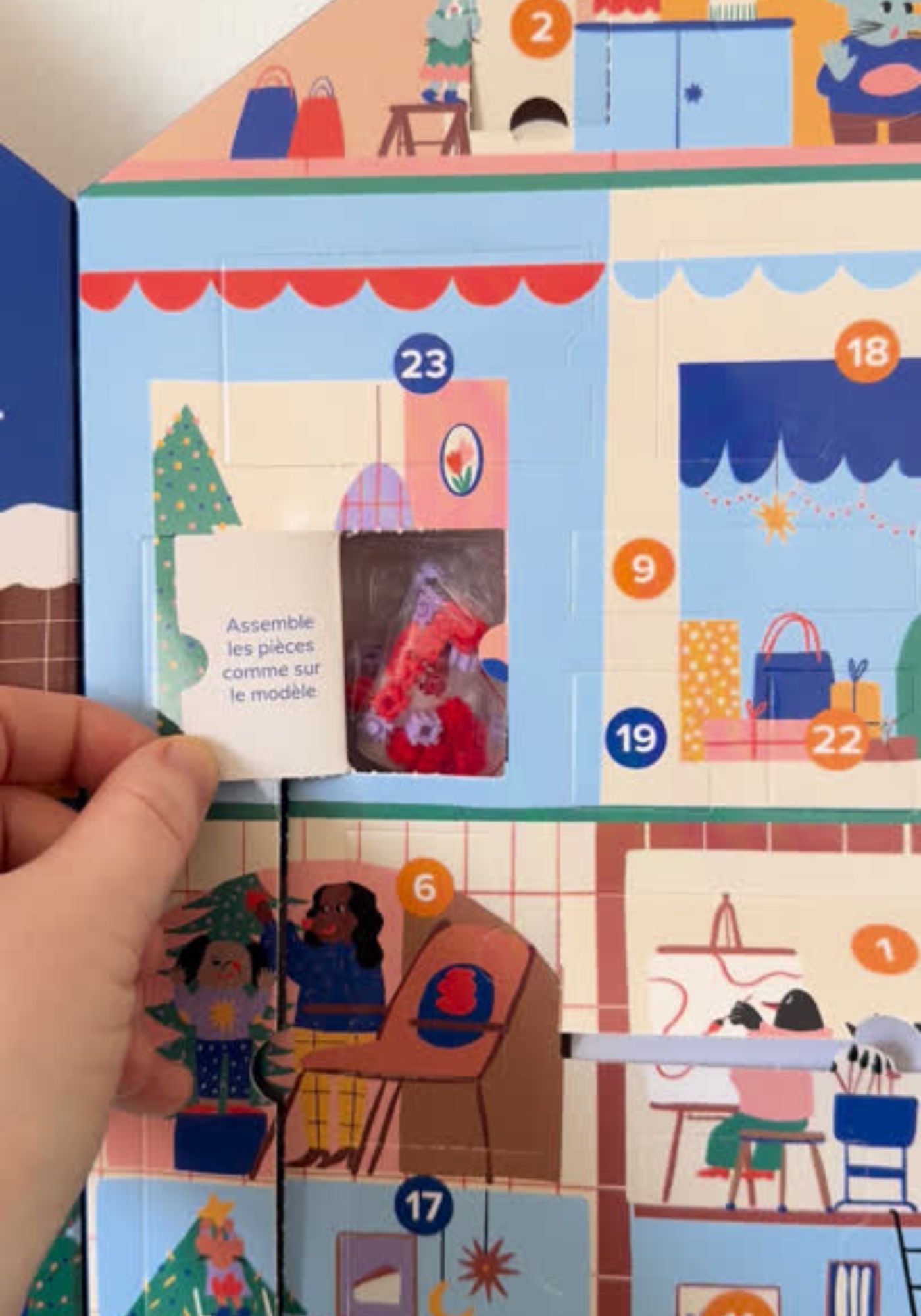 Children's advent calendar with colorful illustrations and numbered pieces