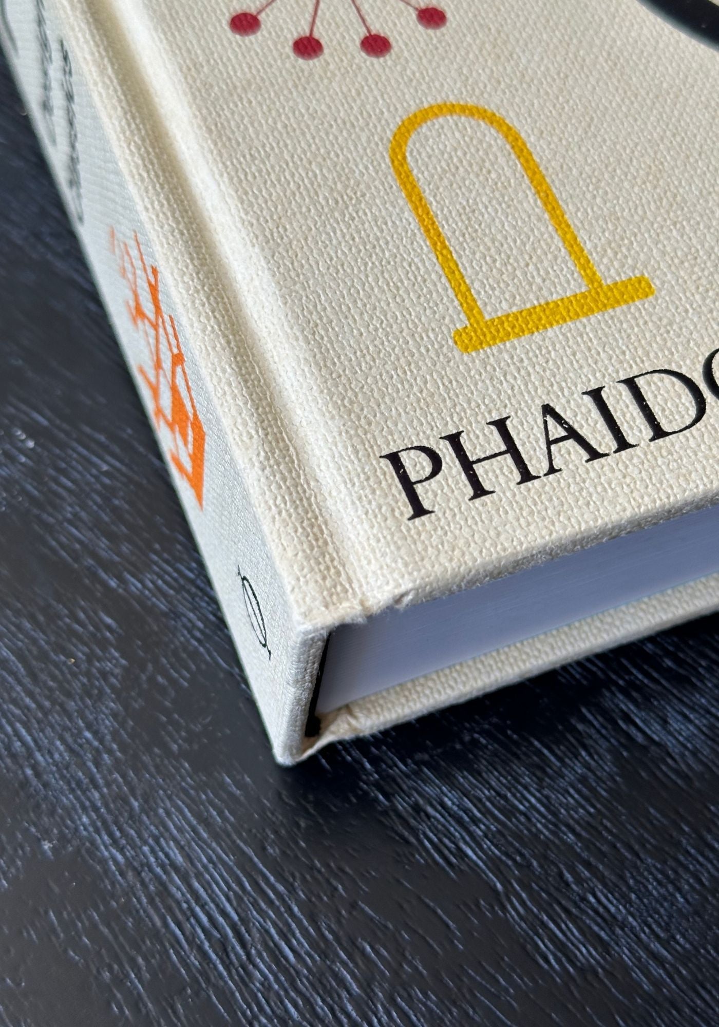 Close-up of a Phaidon book on a dark surface