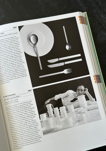 Open book with black and white images of tableware and a person working with ceramics.