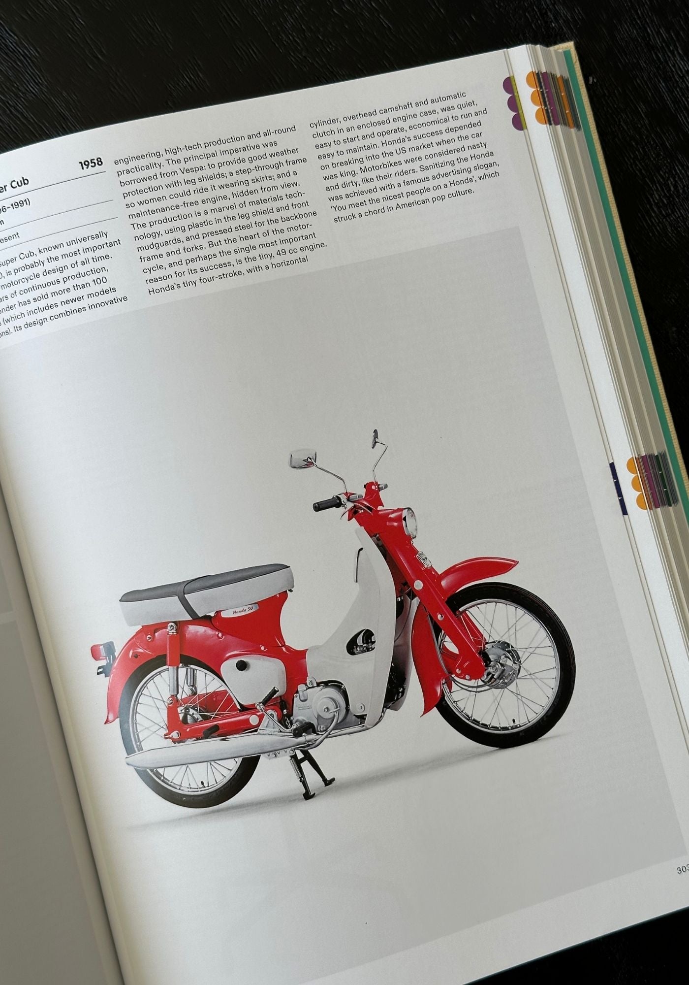 Red scooter illustration on a book page