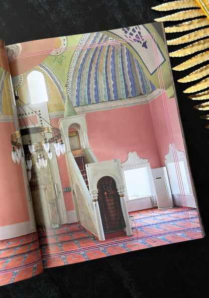 Decorative book with a colorful interior design illustration on a black background