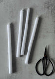 Set of Four Slim White Tapered Candles