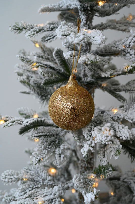 Goldglitzernde Christbaumkugel