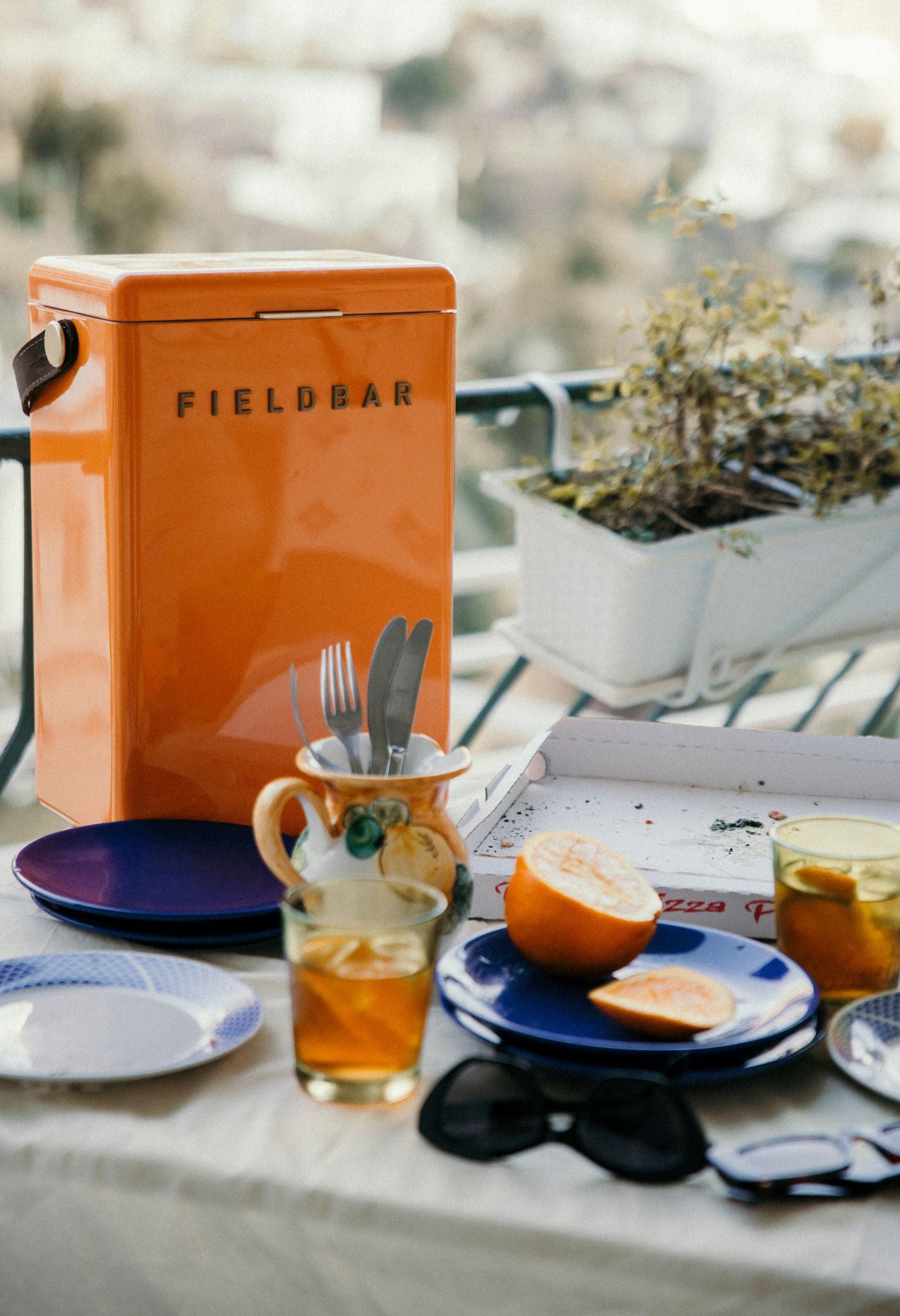 Lifestyle image of Fieldbar Drinks Cooler with wine on table – alfresco dining accessory